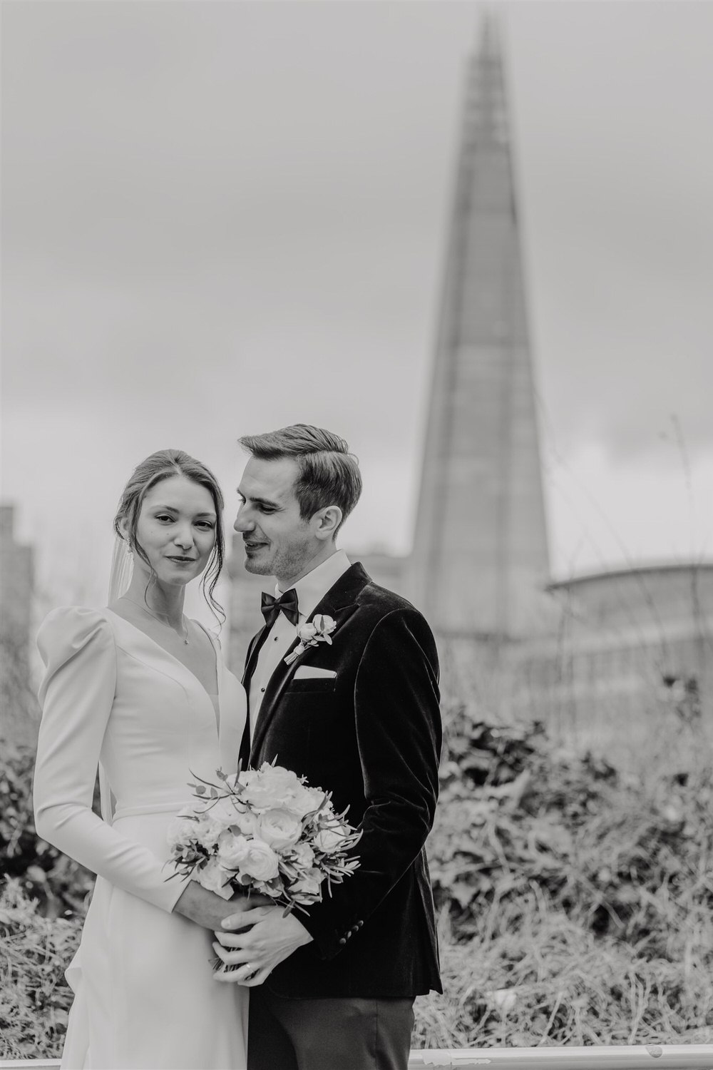 black and white bride and groom couple portraits outside the shard at winter wedding in london