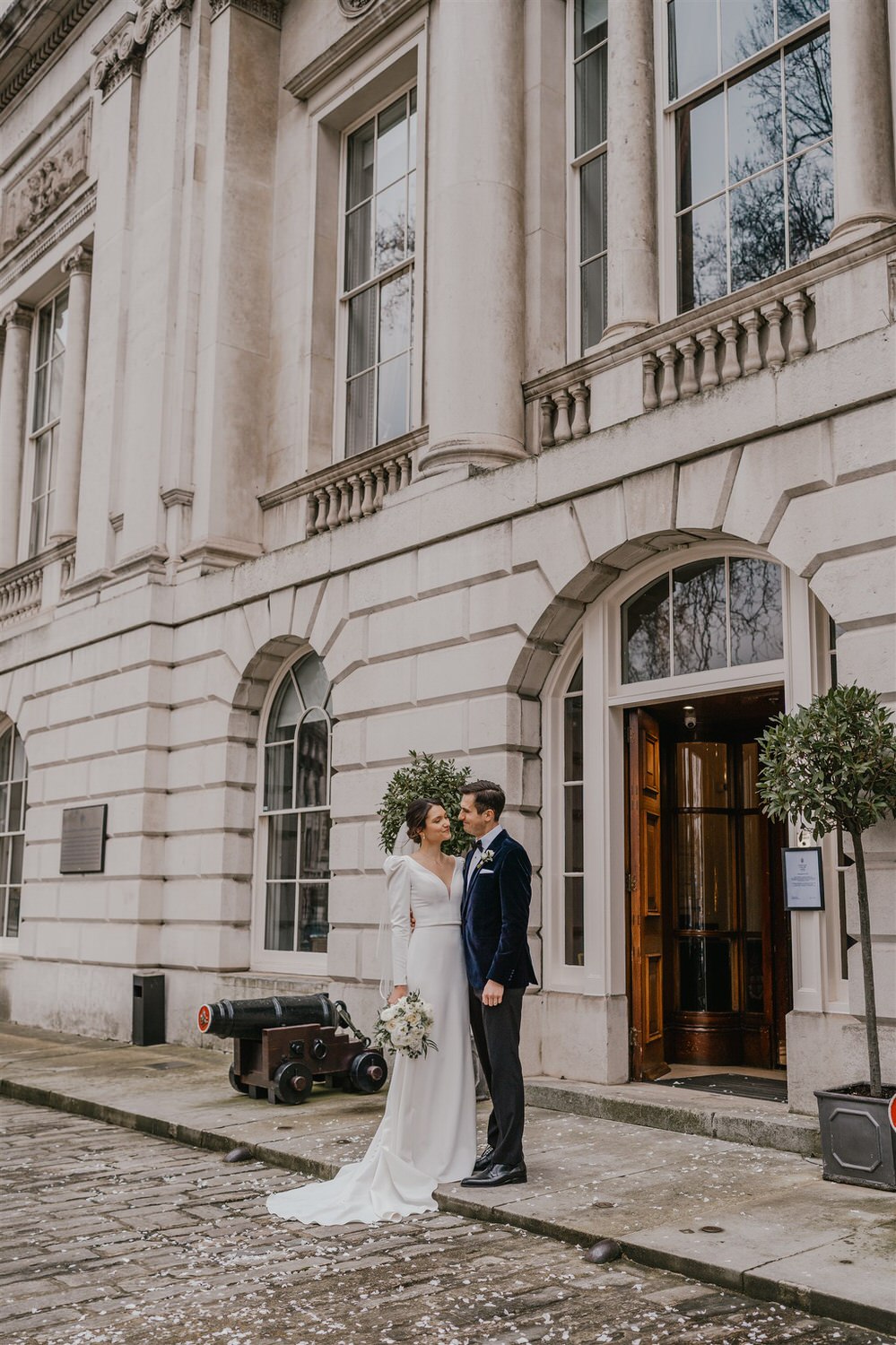 bride and groom couple portraits outside trinity house in london winter wedding