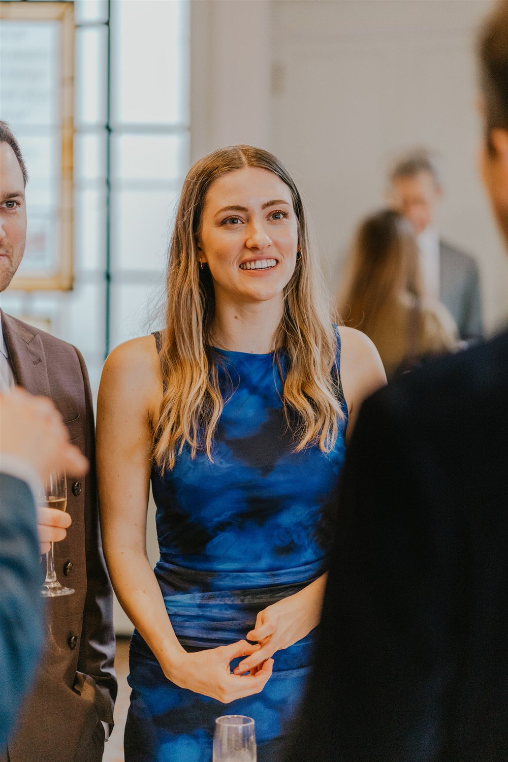 guest candids during drinks reception in the library at trinity house in london