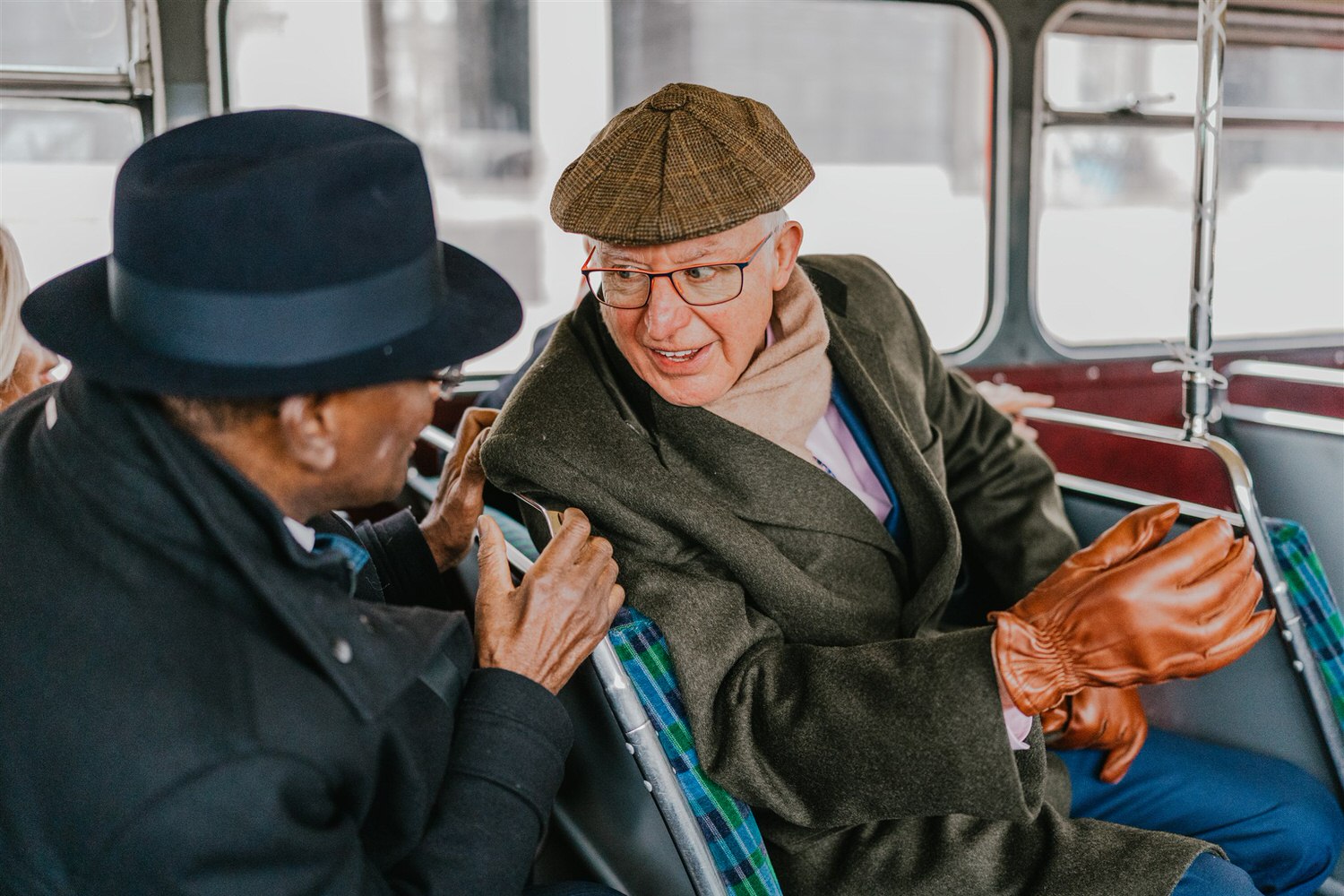 wedding guests on routemaster bus at winter wedding in london tower bridge