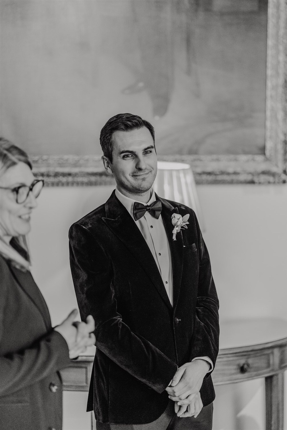 black and white photo of groom awaiting bride before the ceremony at trinity house wedding in london
